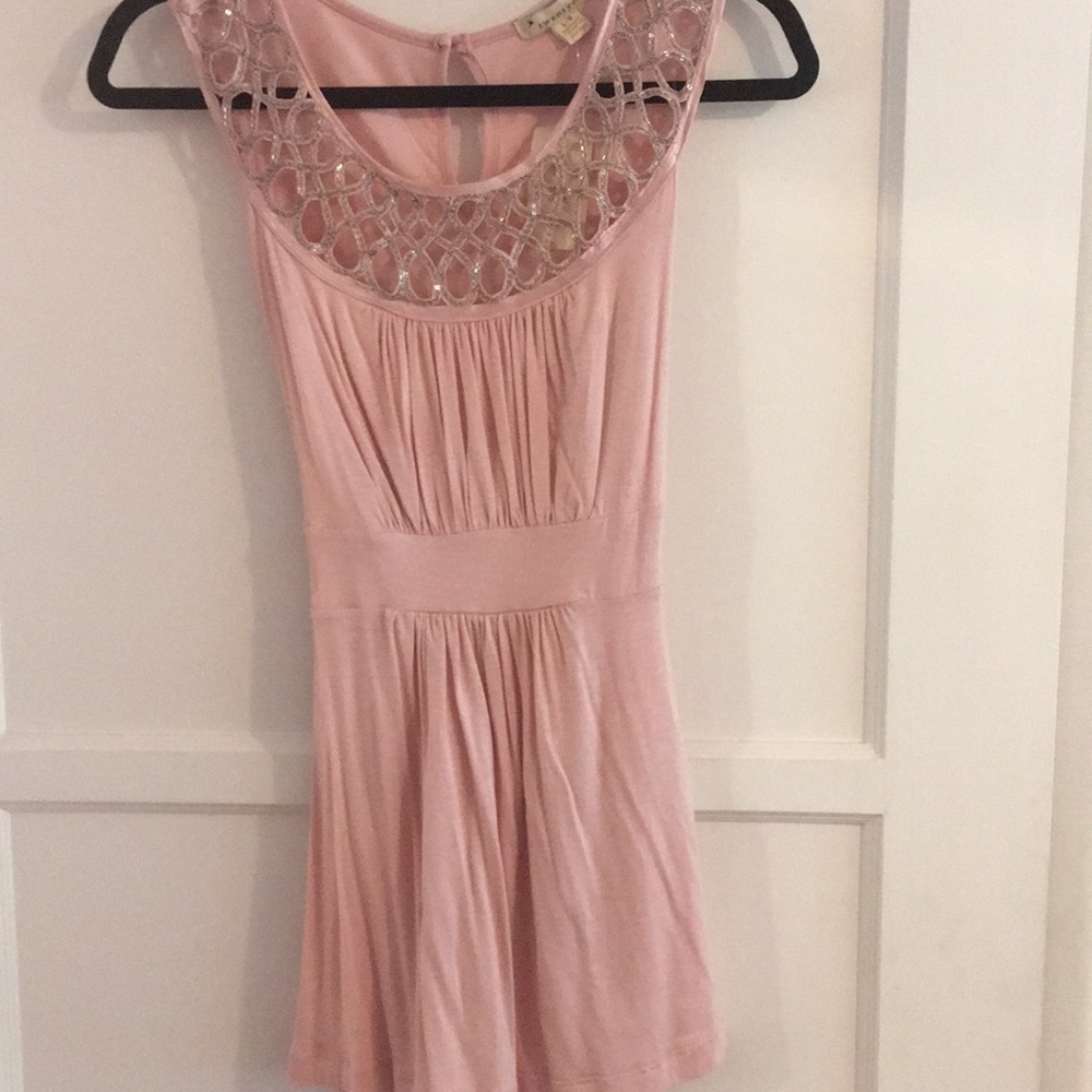 Pink tank top with chain and cutout design